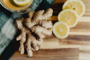 Ginger Shot Recipe (With a Batch Calculator for Any Number of Shots) 3 Fresh ginger root and lemon halves, the two main ingredients in a ginger shot recipe
